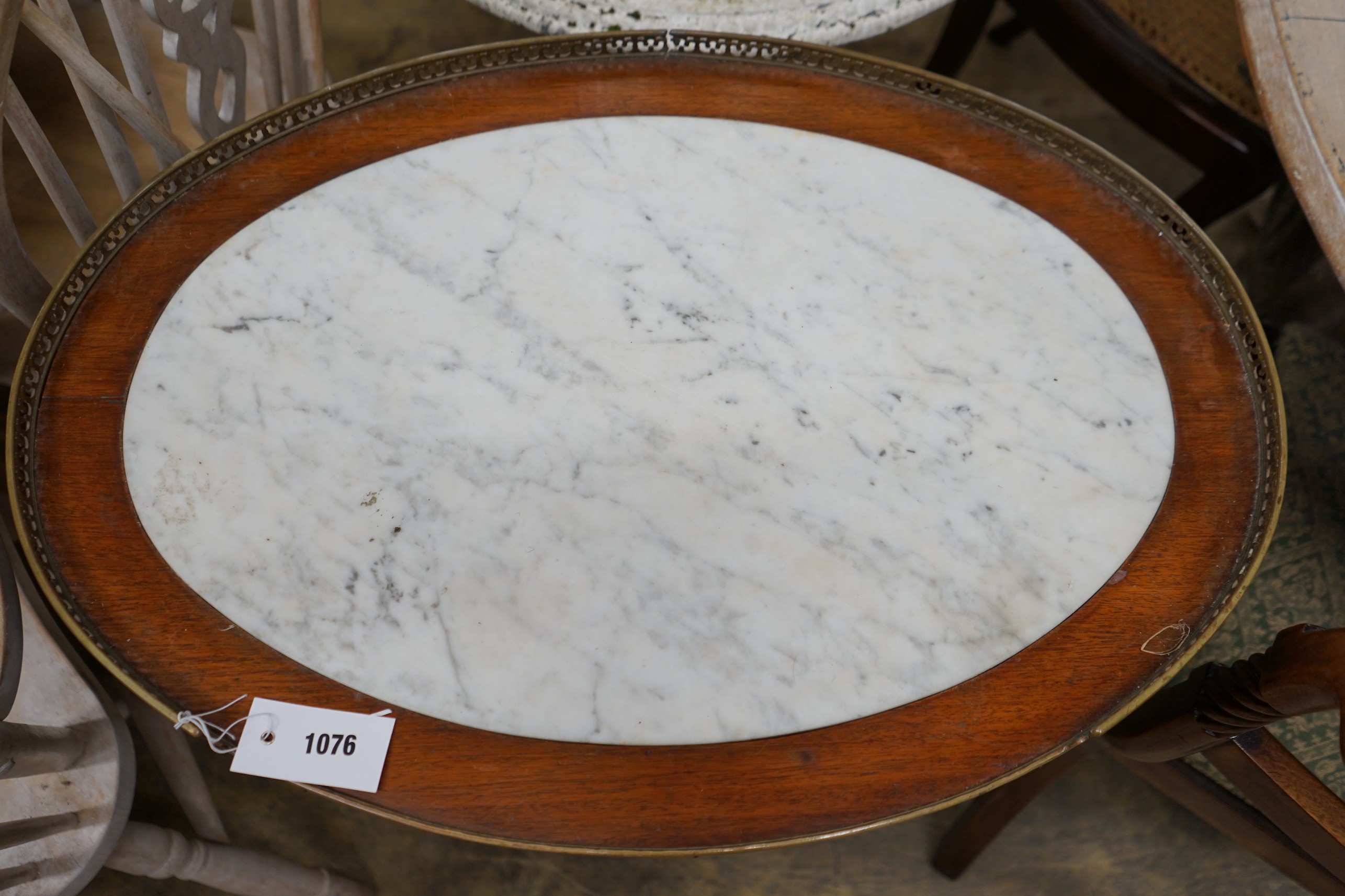 A French oval mahogany marble top two tier centre table, width 68cm, depth 48cm, height 75cm